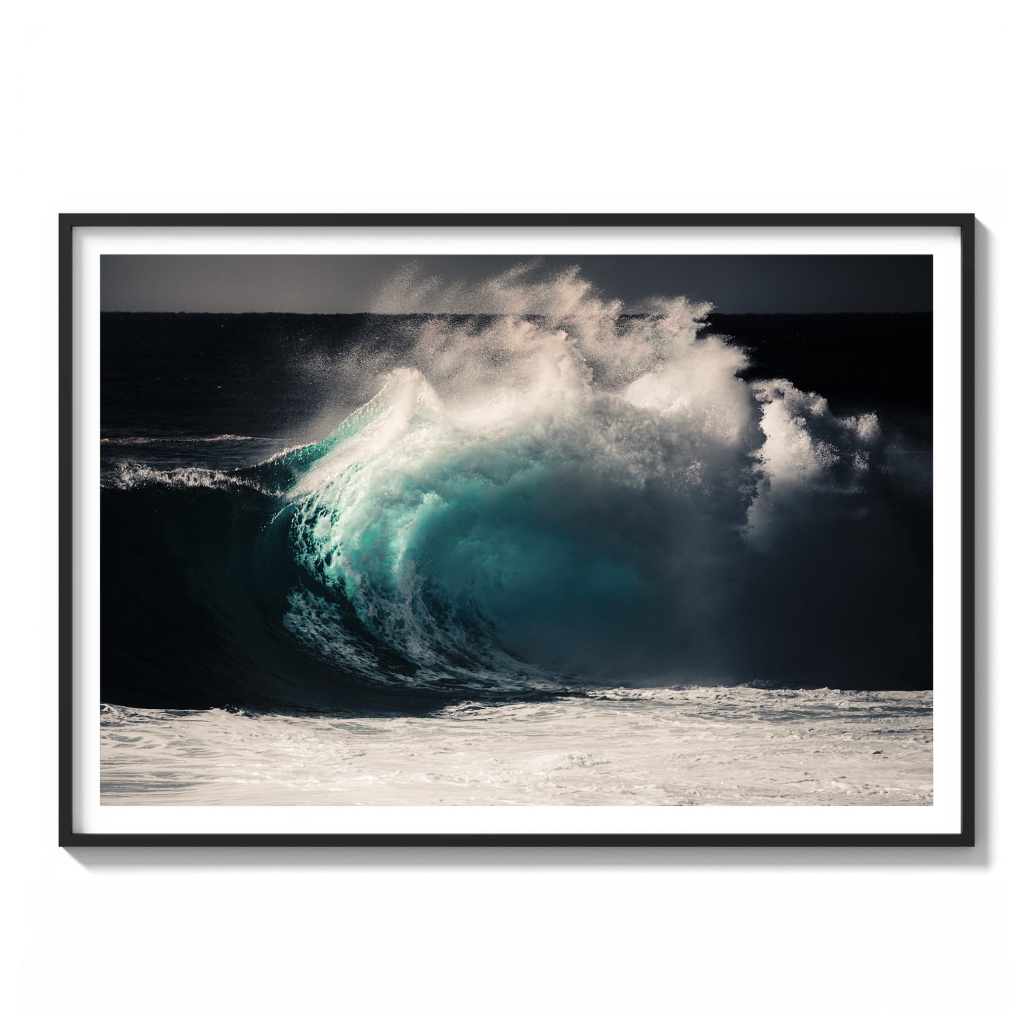 Framed color photograph of a glowing teal wave barrel breaking off the NSW coast of Australia against a dark sky.