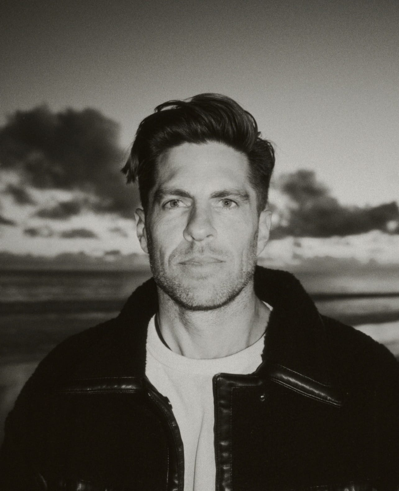 scott gudahl in malibu flash photography just as the sun sets over the ocean on PCH
