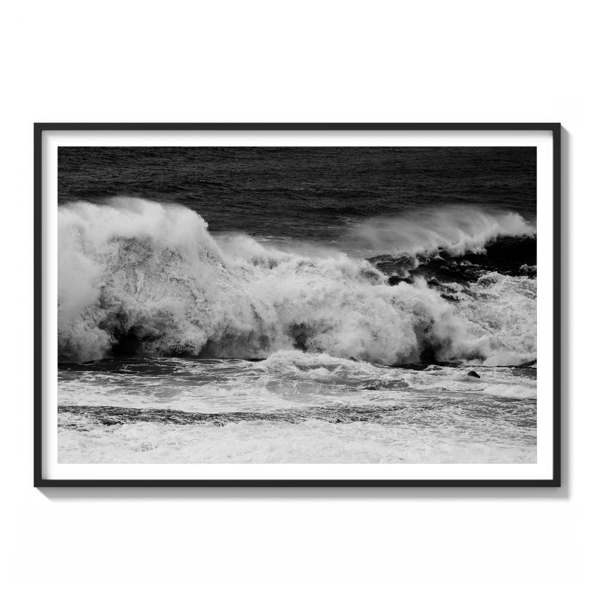 Framed black and white photograph of a large wave collapsing into whitewater along the NSW mid-coast.